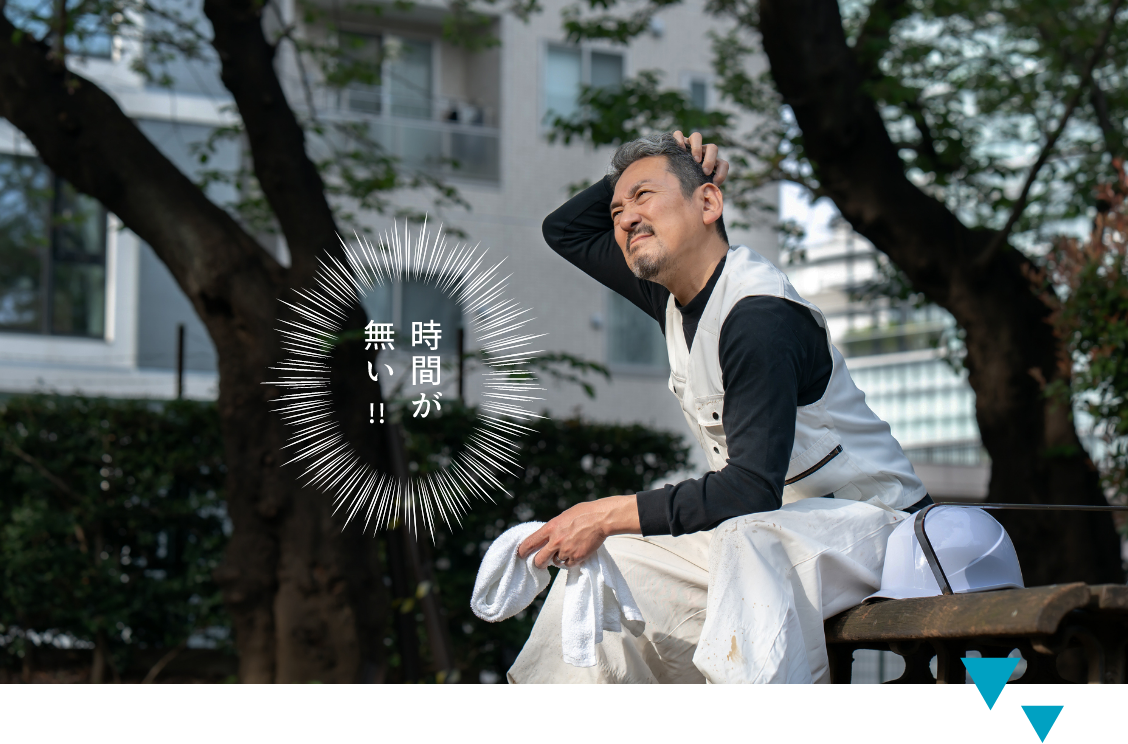 時間がない！！頭を抱えている男性の写真